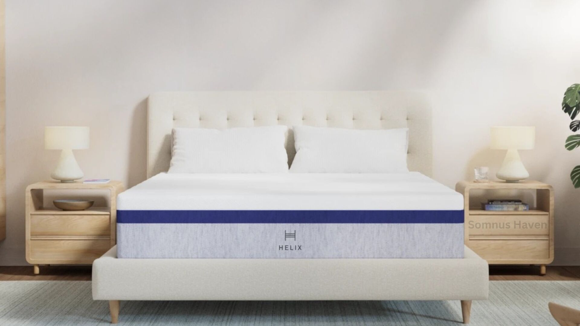 Stylish cream-upholstered bed with tufted headboard, light wood nightstands, and blue-accented mattress.