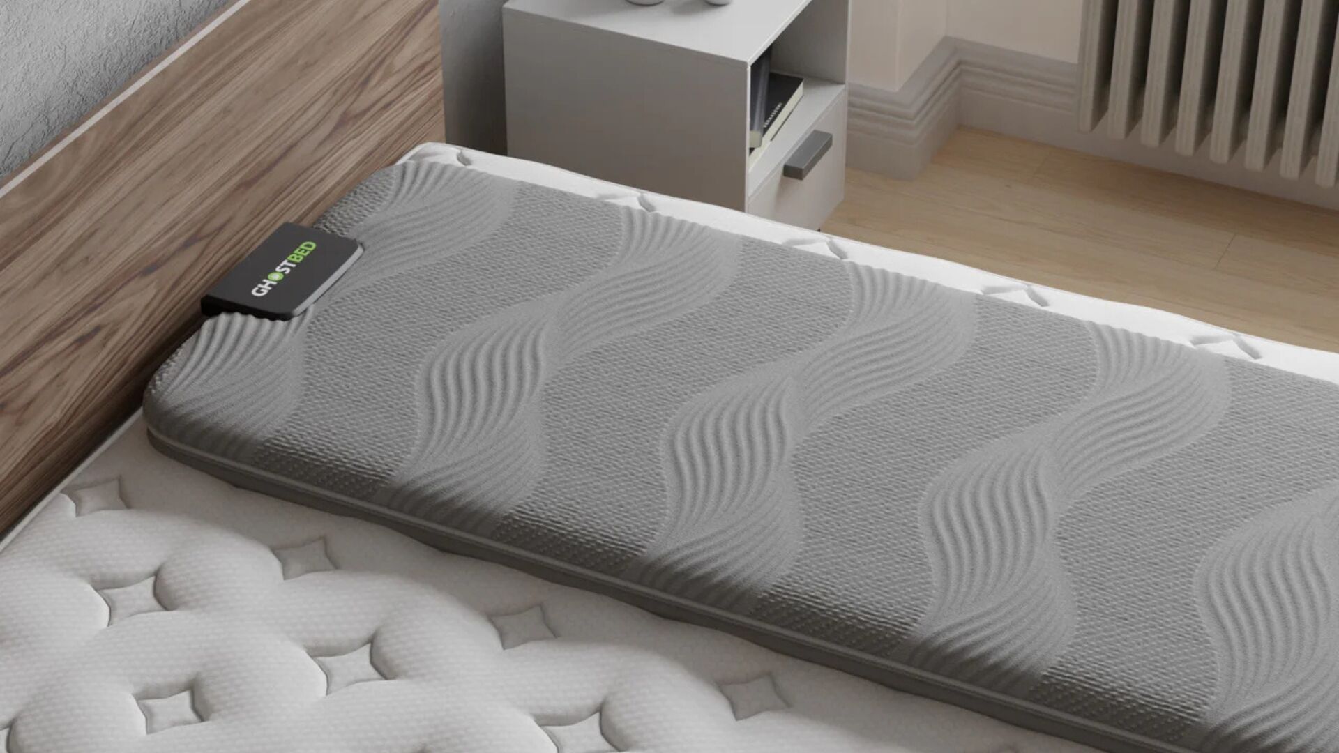 Luxurious gray mattress with wave pattern in modern bedroom on wooden bed frame.