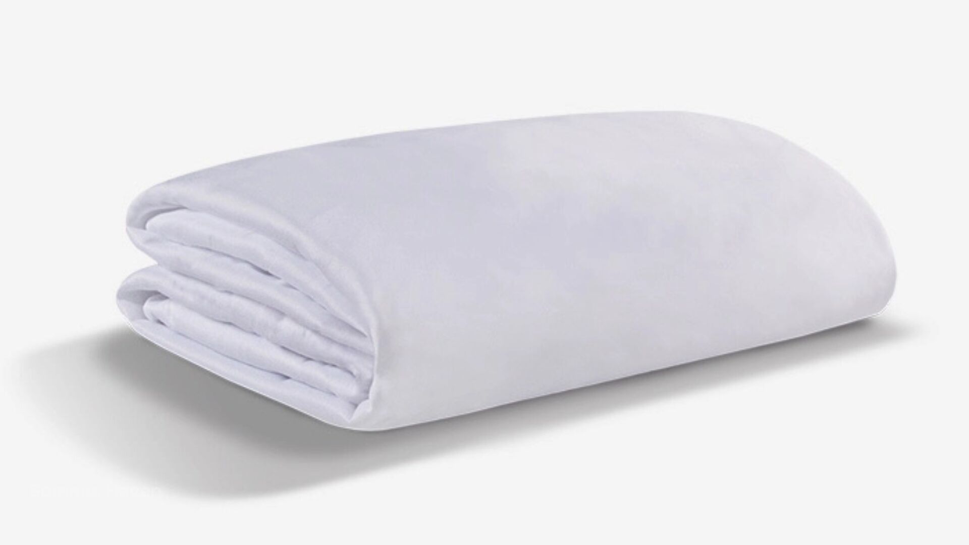 Plush white blanket with soft texture on a neutral background, ideal for home aesthetics.