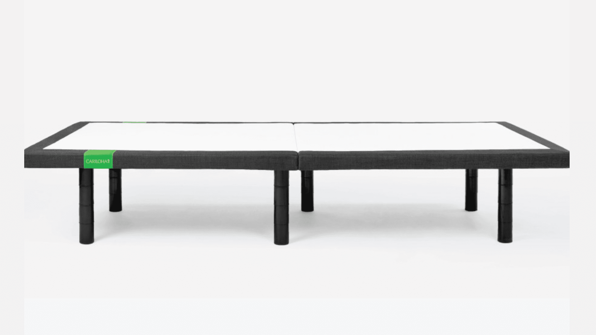 Modern minimalist bed frame with black and white contrast, elevated by black cylindrical legs.