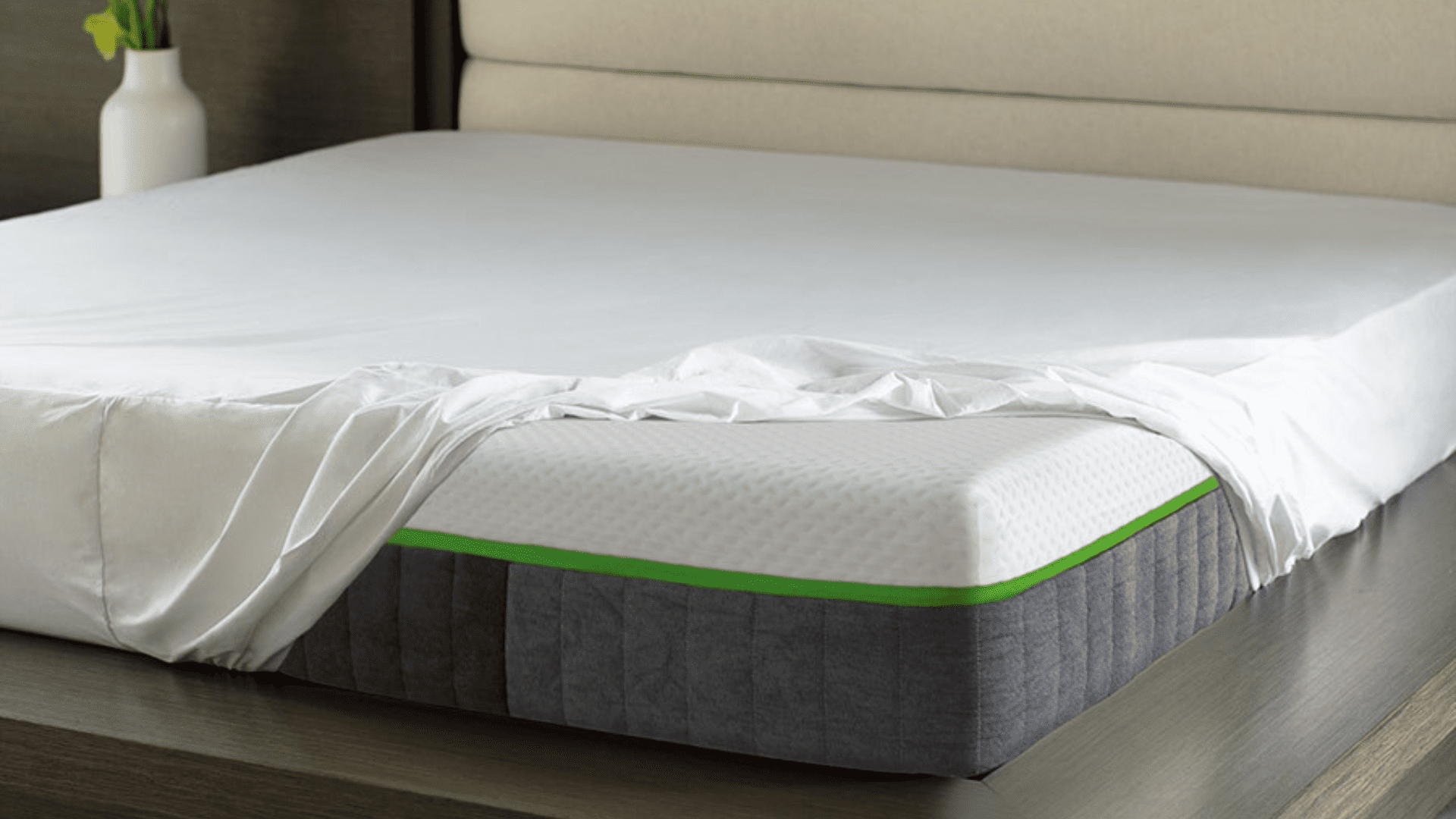 Modern bedroom with elegant mattress design, green trim, and minimalist decor for tranquil relaxation.