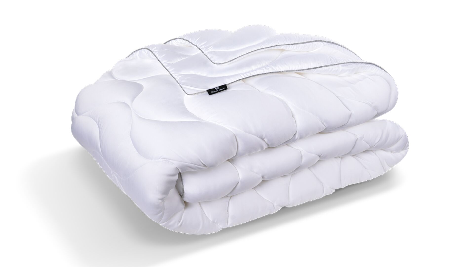 Luxurious white comforter, soft quilted design, easy maintenance, ideal for modern bedroom decor.