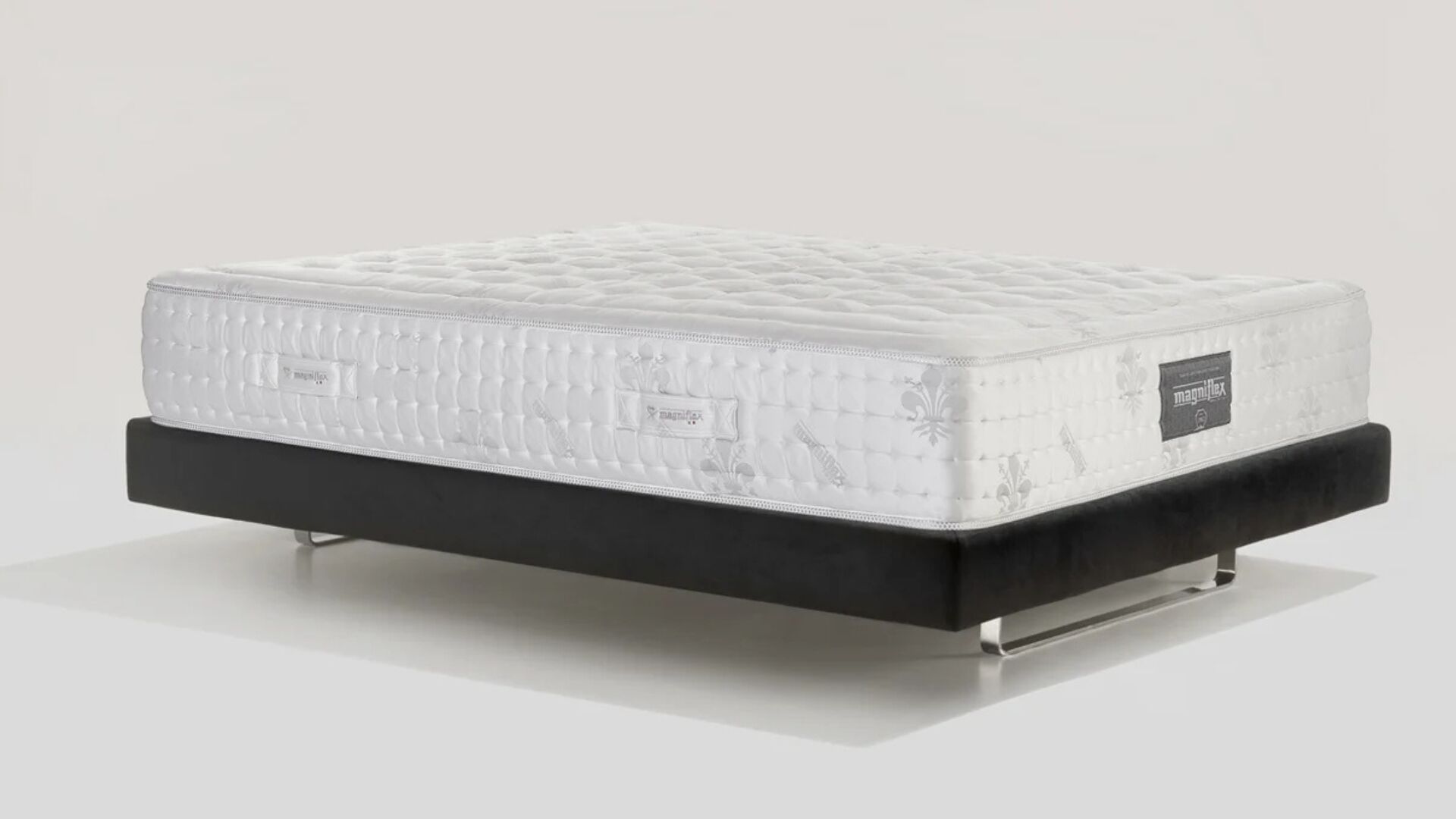 Plush modern mattress on minimalist bed frame for ultimate comfort and style.