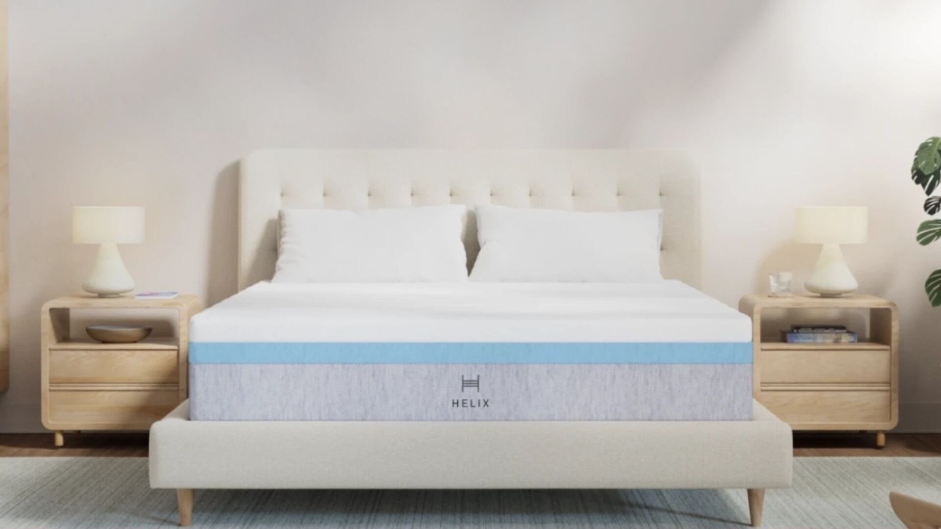 Modern bedroom with plush bed, light gray mattress, wood nightstands, and cozy lighting.