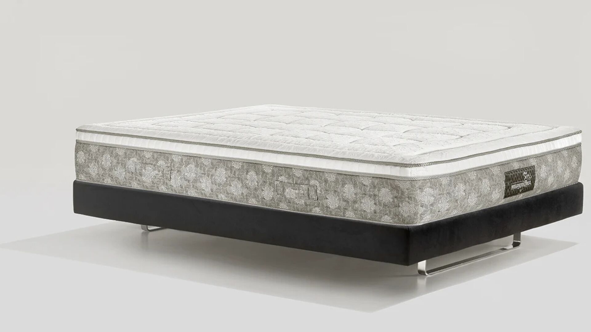 Modern mattress with sleek design, neutral tones, and a sturdy platform base.