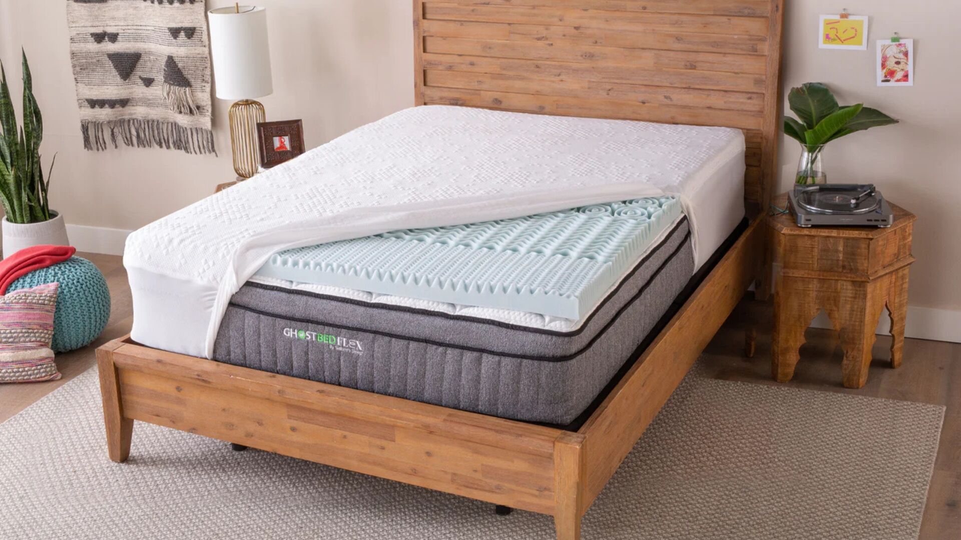 Gel-infused memory foam mattress in modern wood-framed bedroom with bohemian decor.