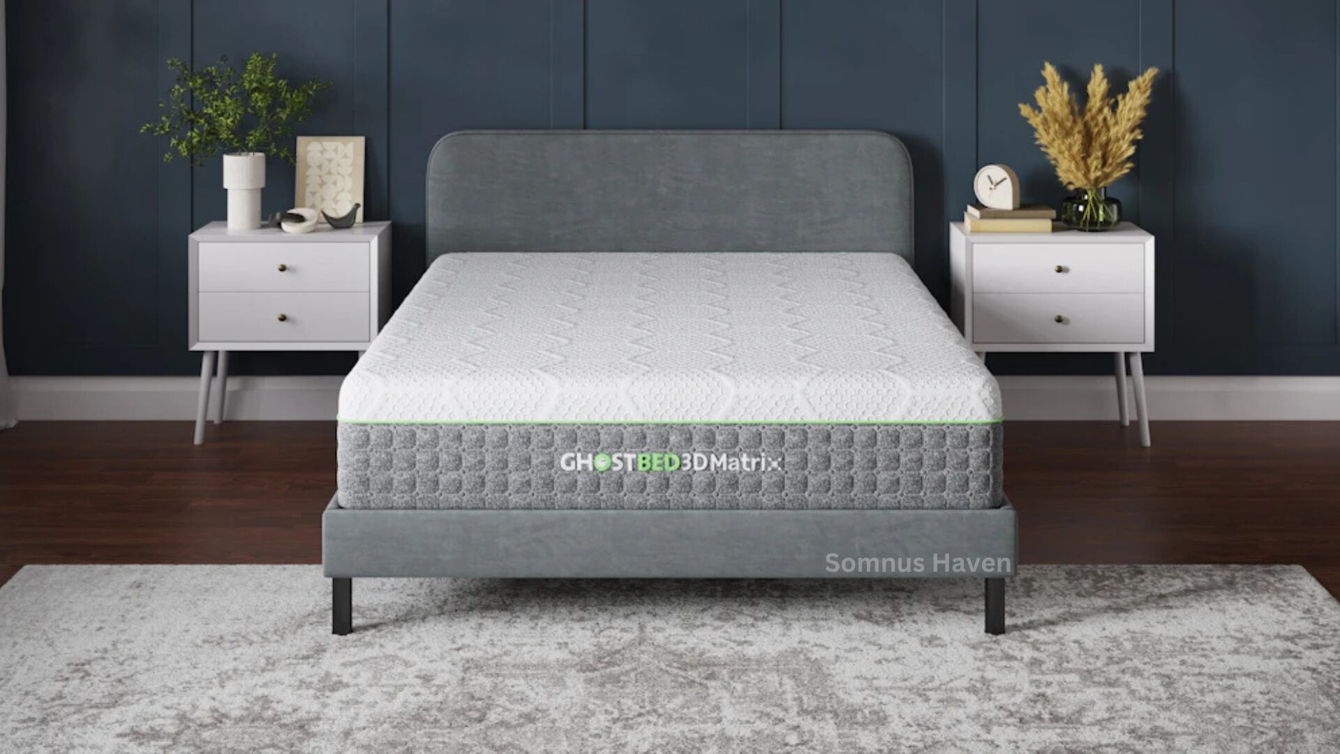 Modern bedroom with gray bed, teal wall, white nightstands, plants, and patterned rug.