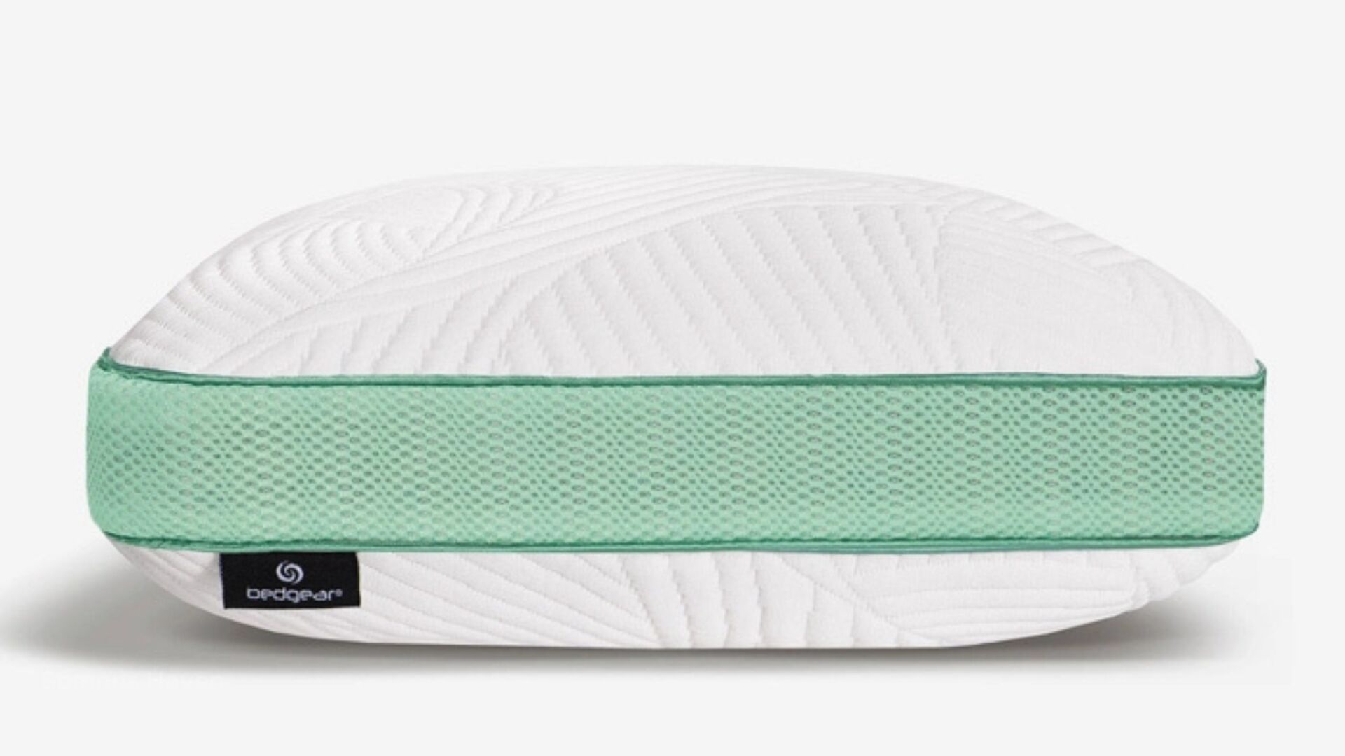 Modern pillow with curved design, mint green accents, and embossed textured white surface.