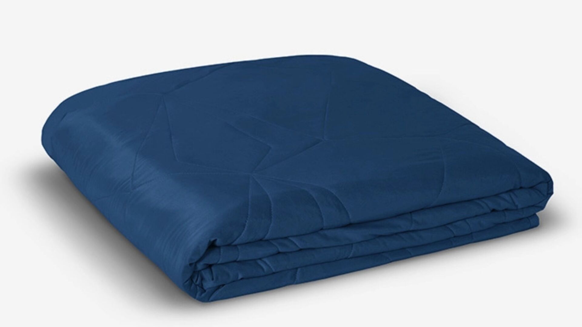 Navy blue satin quilt: elegant, minimalistic, and cozy for stylish room aesthetics.